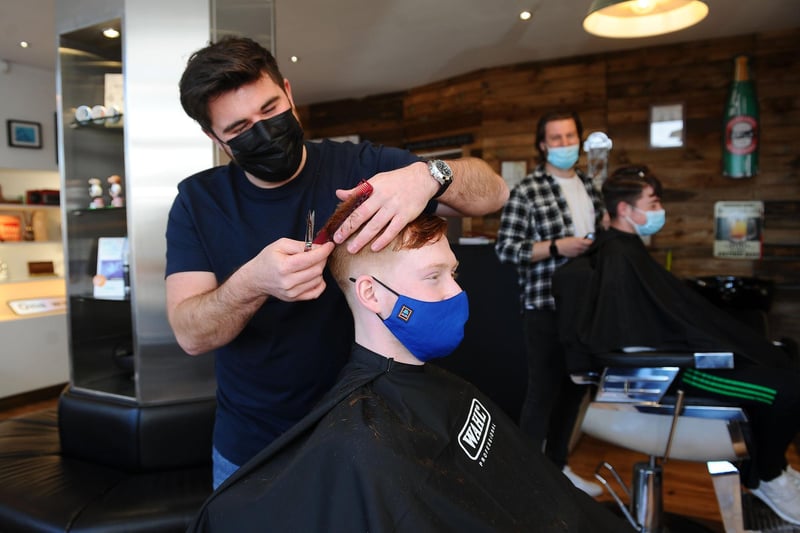 Dean Wallace gets to work on customer Craig Smith's barnet as Bish Bash Barbers re-opens after lockdown