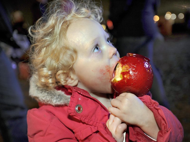 Enjoying her toffee apple is Isabelle Porter aged 2 from Wybourn at the After Dark Event at the Don Valley Bowl, November 5, 2011