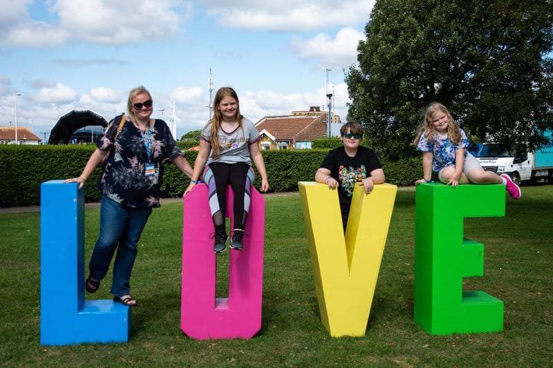 Victorious Festival on Day 2. Pippa Bostock of Portsmouth Creates and family at the Love sign. Picture: Emma Terracciano