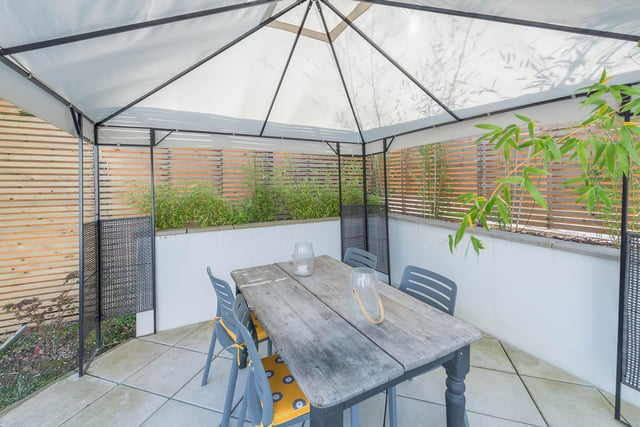 A pleasant seating area has been created in the garden - ideal for al fresco dining.