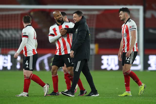 Sheffield, England, 24th April 2021. David McGoldrick of Sheffield Utd and Paul Heckingbottom interim manager of Sheffield Utd enjoy the win during the Premier League match at Bramall Lane, Sheffield. Picture credit should read: Simon Bellis / Sportimage