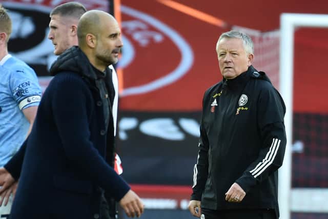 Sheffield United manager Chris Wilder and his Manchester City counterpart Pep Guardiola at the end of today's game at Bramall Lane. (Photo by RUI VIEIRA/POOL/AFP via Getty Images)