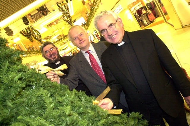 St Johns Hospice memory tree is back in the Frenchgate Centre, Doncaster. Putting the first bows on the tree are, left to right, archdeacon of Doncaster Robert Fitz-Harris, John Clark chair of the hospice appeal and father Gerrard Harney in 2001