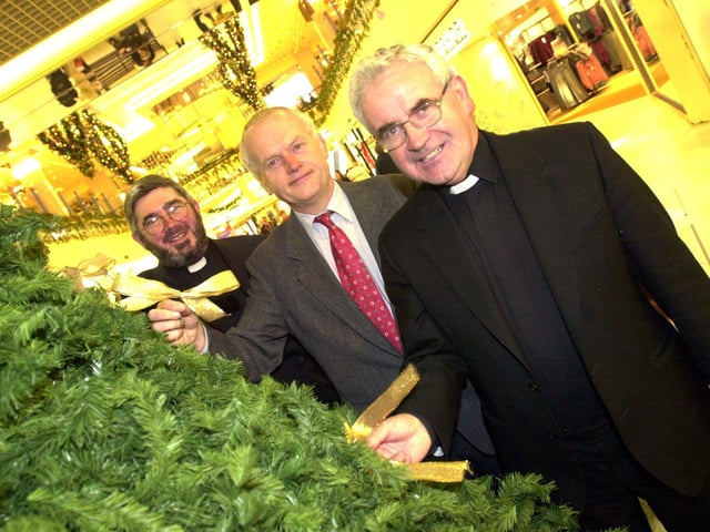 St Johns Hospice memory tree is back in the Frenchgate Centre, Doncaster. Putting the first bows on the tree are, left to right, archdeacon of Doncaster Robert Fitz-Harris, John Clark chair of the hospice appeal and father Gerrard Harney in 2001