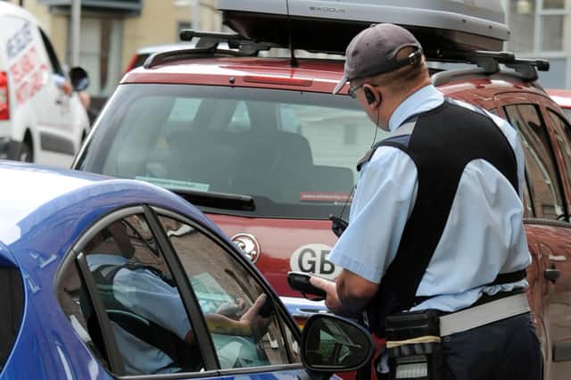 A parking warden in Sheffield City Centre.