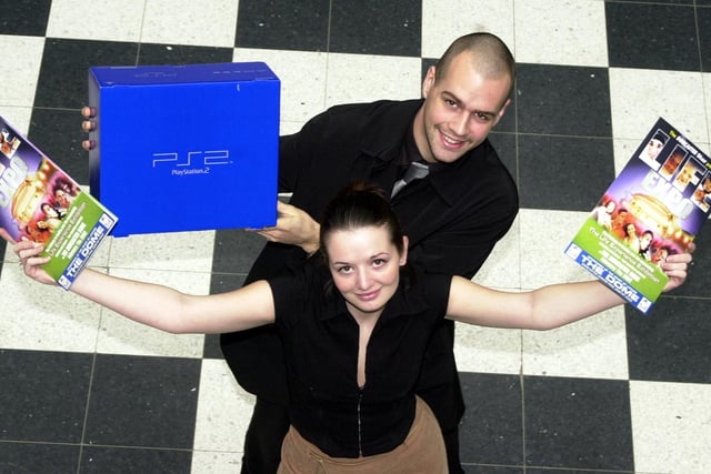 Abigail Bailey and Andrew Whitham got ready for the Life Expo 2002 where a PlayStation 2 was a prize at the event.