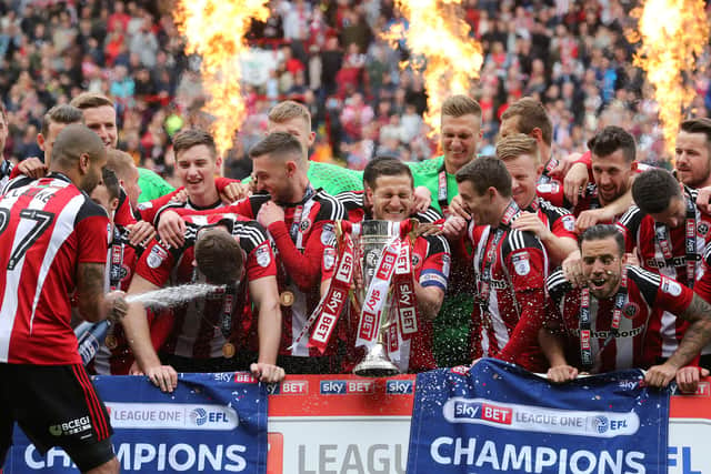 Leon Clarke eventually opened the champagne before spraying it all over his teammates - Pic David Klein/Sportimage