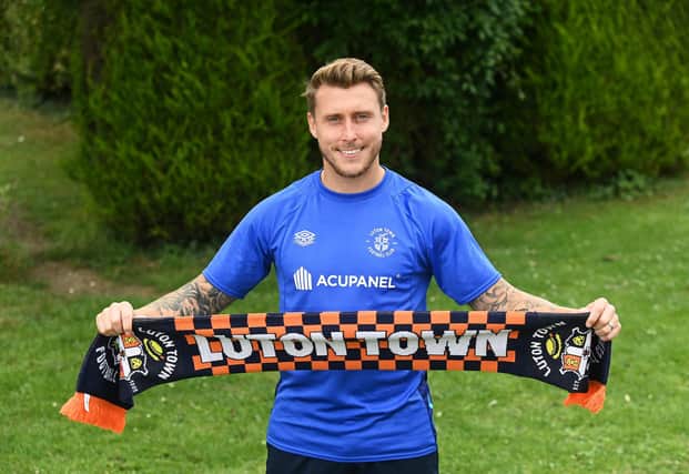 The attacking midfielder has signed for Luton Town after spending the second-half of last term on loan at Millwall. 
