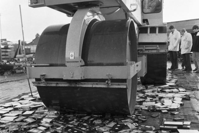 500 pirate video tapes, seized by Trading Standards officers, are crushed by a road roller in Edinburgh, January 1990,  on behalf of Lothian Regional Council.