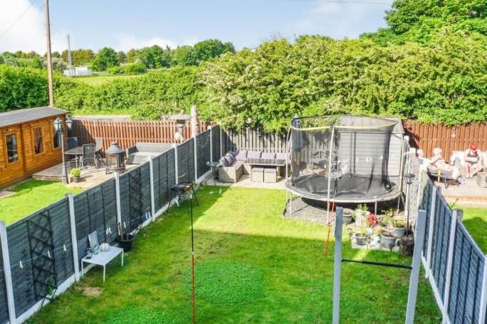 Secure private garden to the rear with large lawn area