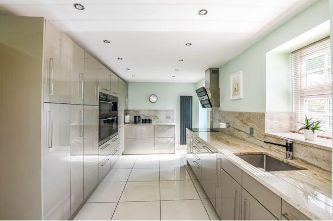 The kitchen is light and airy with a range of fitted appliances. The open plan design means it complements the family room perfectly.