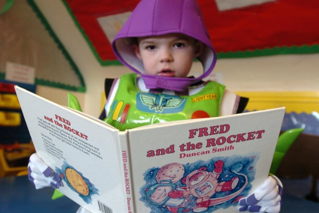 .  Jonathan Cotterell aged three read a book as part of the Small World Nursery's  national book day celebrations in 2005