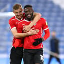 Daryl Dike with Michal Helik after scoring for Barnsley against Huddersfield