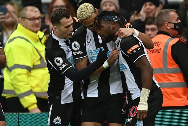 Newcastle United's French midfielder Allan Saint-Maximin (R) celebrates with teammates after scoring the opening goal of the English Premier League football match between Newcastle United and Manchester United (Photo by PAUL ELLIS/AFP via Getty Images)