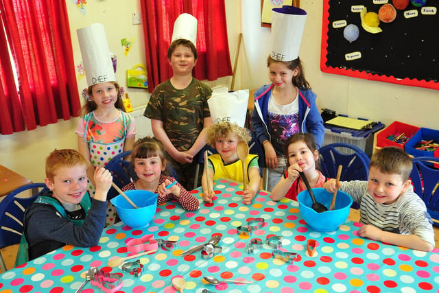 Children from Oscars Playscheme get ready to bake their Easter Hot Cross Buns. Can you spot anyone you know from this 2014 photo?