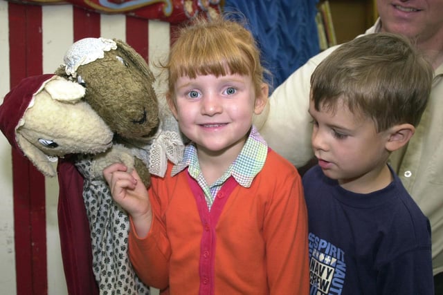 Larissa Hodgkinson, aged four, and Luke Haslam,. aged five, say hello to two of the Pinxton Puppets at Armthorpe Library in 2000
