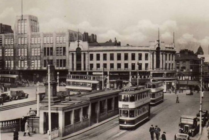 Fitzalan Square with public toilets, which are the low buildings being passed by the trams
