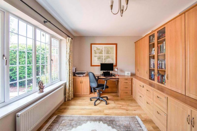 Study - With a front facing double glazed window. The study has a range of fitted office furniture and desk. There is karndean flooring and a central heating radiator.