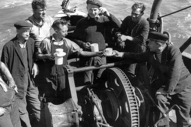 5th June 1940:  The crew of tug 'Sunvill' one of the many small craft which took part in the evacuation of British and allied troops from Dunkirk.  (Photo by Fox Photos/Getty Images)