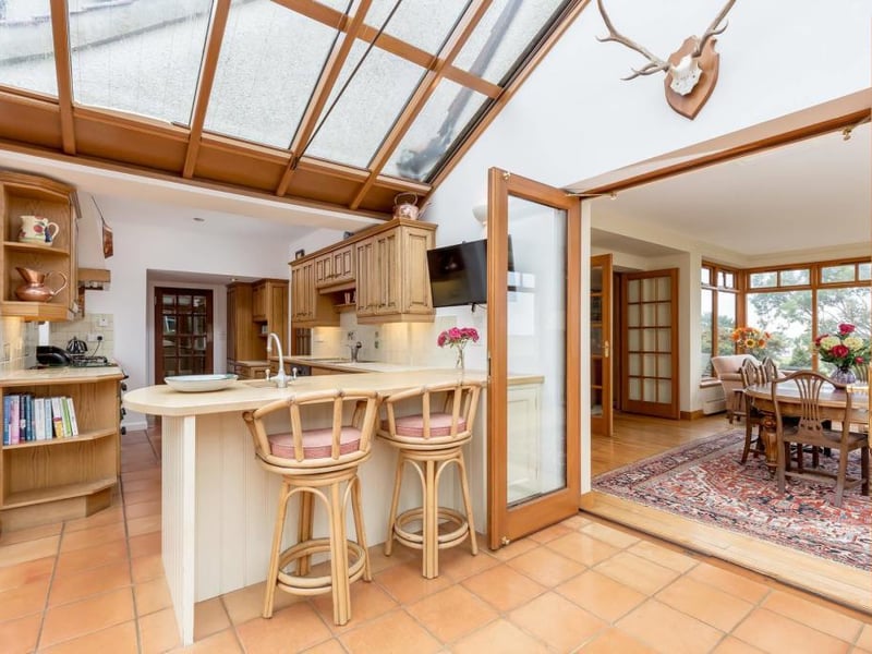 Conservatory through to kitchen, with dining room on right.