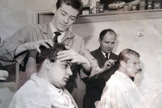 Hairdresser Steve Bajdala (right) is pictured cutting the late Bobby Moore's hair. England captain Bobby was in Sheffield with the rest of the England World Cup squad. They were staying at the Grand Hotel, just prior to the famous win over Germany at Wembley.