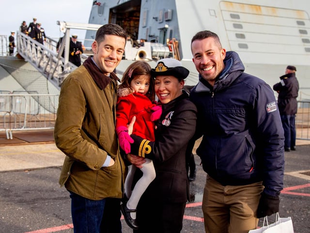 Daniel Hill, Sophia 3, Kelly Jenkins-Hill, Simon Jenkins in front of HMS Defender. Picture: Habibur Rahman