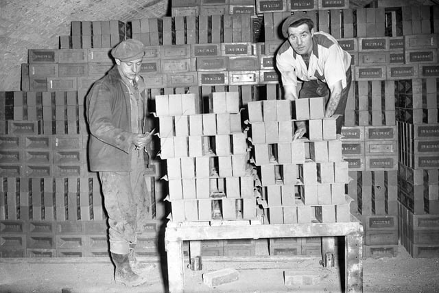 Bricks are stacked in a chamber of the kiln to undergo a drying and firing process at Lumley Bricks in April 1956.