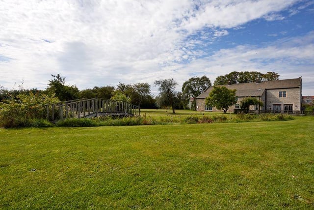 The property is set upon approximately four acres of well-maintained grounds and paddock space, providing a wealth of outdoor space to enjoy.
