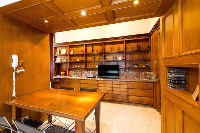 The kitchen is also large and oak panelled