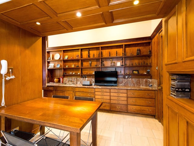 The kitchen is also large and oak panelled