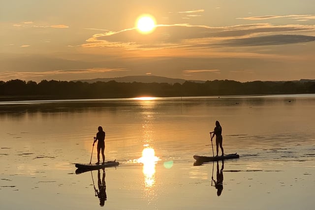 Beautiful light, still waters and perfect silhouette reflections in this special image of paddle boarders out bright and early enjoying the sunrise at Langstone harbour taken by Tony Jolliffe.