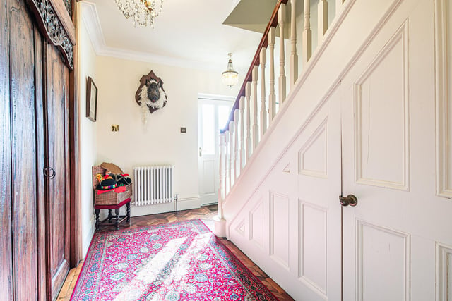 Parquet flooring catches the eye in the entrance hall.