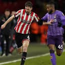 Chris Basham is back in the Sheffield United side to face Millwall this afternoon: Andrew Yates/Sportimage
