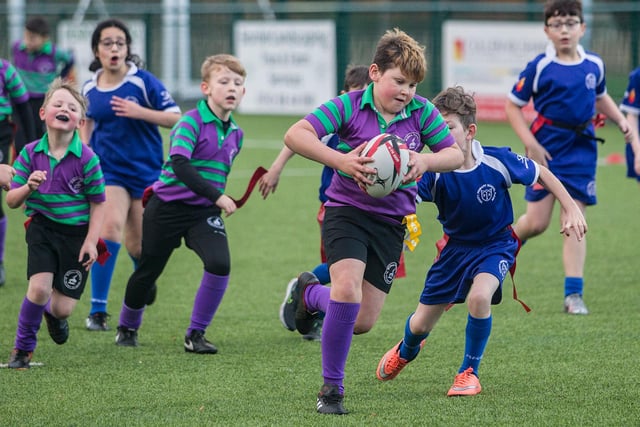 Kieran McGregor running with the ball for Wilton Primary School