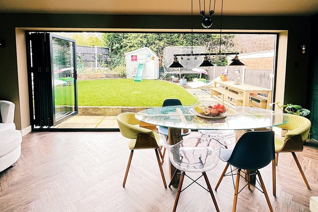 Bifold doors open to the garden, giving a lovely view.