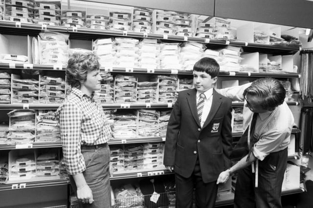 A boy is fitted with his new school uniform at Aitken and Niven, George Street Edinburgh. Picture taken August 1983.