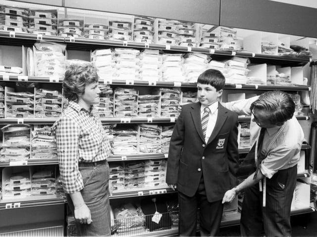 A boy is fitted with his new school uniform at Aitken and Niven, George Street Edinburgh. Picture taken August 1983.
