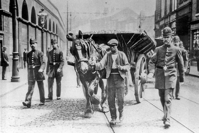 A carter with a police escort during the 1911 Coal Strike with Police Sgt Joe Hurst, right. www.picturesheffield.com Ref: s03756