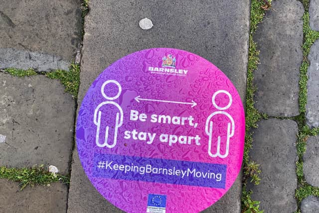 Social distancing signs on streets outside pubs and restaurants in Barnsley