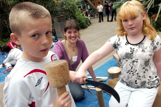 Josh McCabe and Katie Savage (both 11) from Pipworth School split wood with help from Coralie Hopwood (centre), in the Winter Garden in 2007