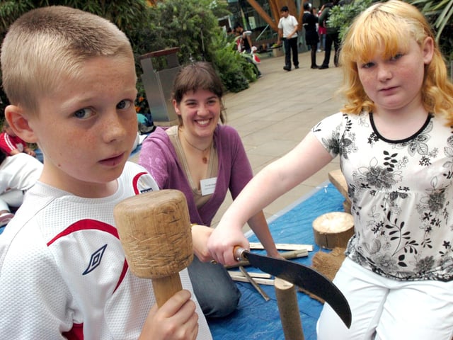 Josh McCabe and Katie Savage (both 11) from Pipworth School split wood with help from Coralie Hopwood (centre), in the Winter Garden in 2007