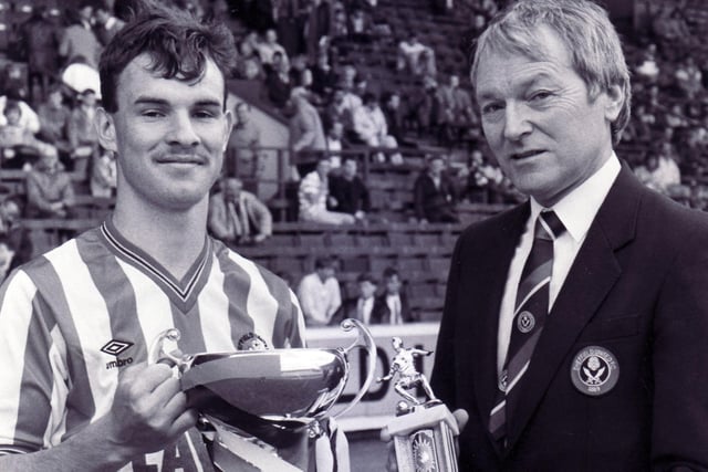 Peter Beagrie receives the Player of the Year award from managing director, Reg Brealey in May 1987.
