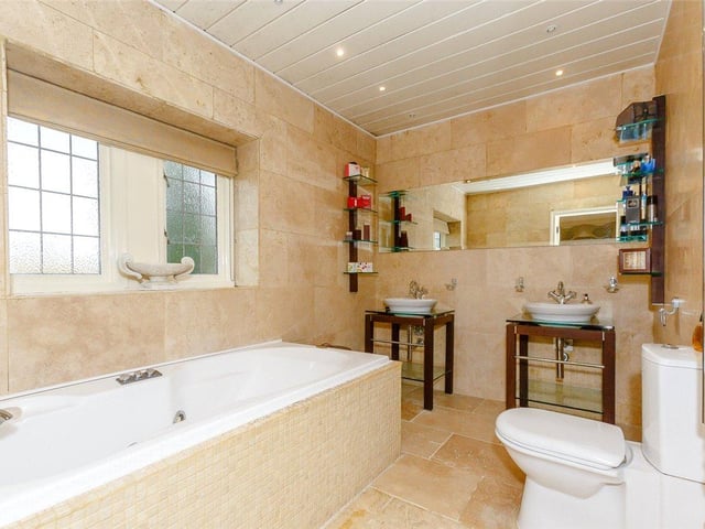Two of the five bedrooms have their own contemporary en-suite facilities, and there is an additional modern house bathroom.