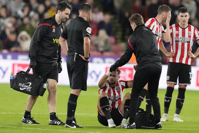 Sheffield United are sick of seeing scenes such as this one, involving George Baldock: Andrew Yates / Sportimage