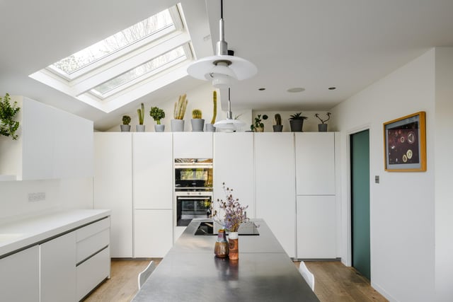 The Balthaup kitchen is both modern and bright, with fitted cupboards and appliances, and plenty of cooking, preparation and pantry space, plus an adjoining utility room.