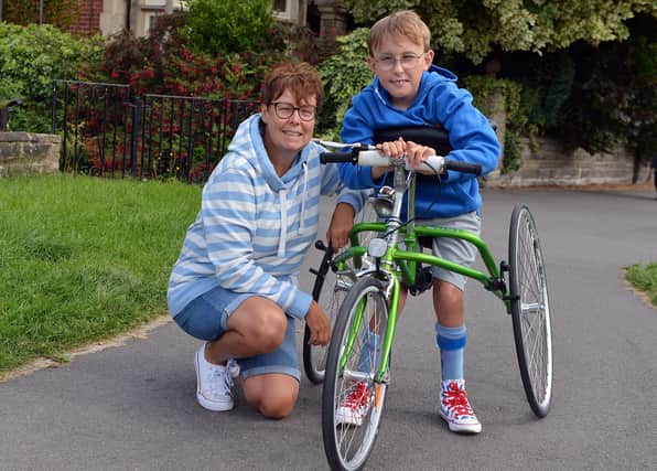 'Captain' Tobias pictured with his mum Ruth Garbutt ahead of the completion of his second marathon on Saturday