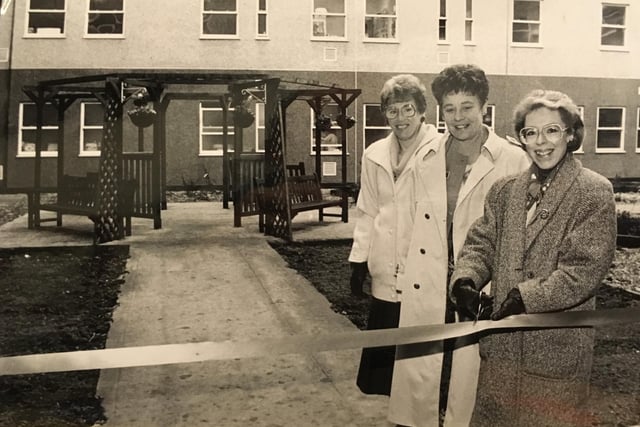 Hospital Chief Executive Joan Rogers opened a new garden completed by Phillips Petroleum in November 1993. She was accompanied by director of quality Rosalind Footitt (centre), and Pat Styles of Phillips Petroleum.