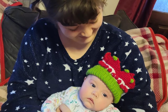 Baby Freya wears a Christmas crown knitted by her Nana. Pictured with Auntie Polly Abbott.