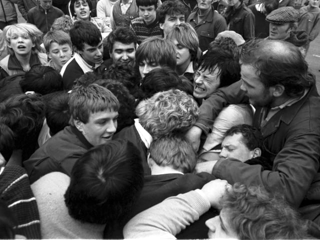 Uppies and Doonies wrestle for the ball during the Jethart Hand Ba' in March 1985.