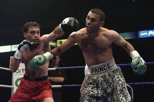 Manuel Calvo of Spain lands a left jab during the IBO Featherweight Championship of the World fight between Prince Naseem Hamed and Manuel Calvo of Spain at the London Arena on May 18, 2002. (Photo by John Gichigi/Getty Images)